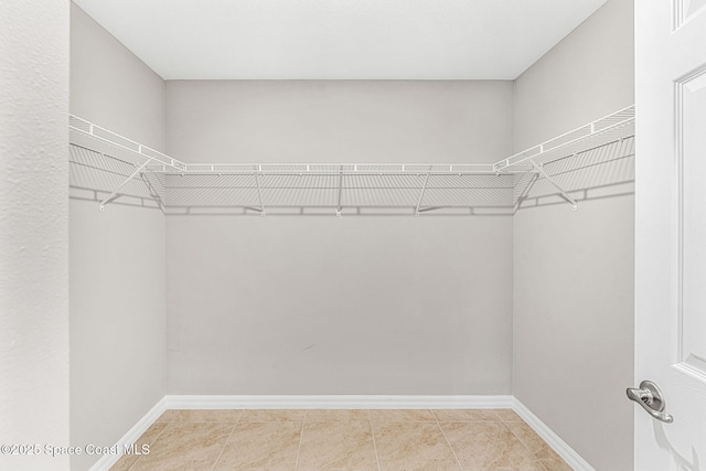 1591 Palatka Rd SE, Palm Bay, FL 32909 - spacious closet featuring tile patterned floors