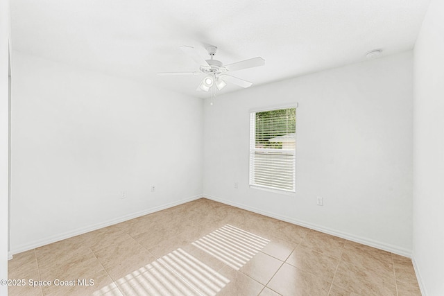 1591 Palatka Rd SE, Palm Bay, FL 32909 - empty room with a ceiling fan, baseboards, and tile patterned flooring