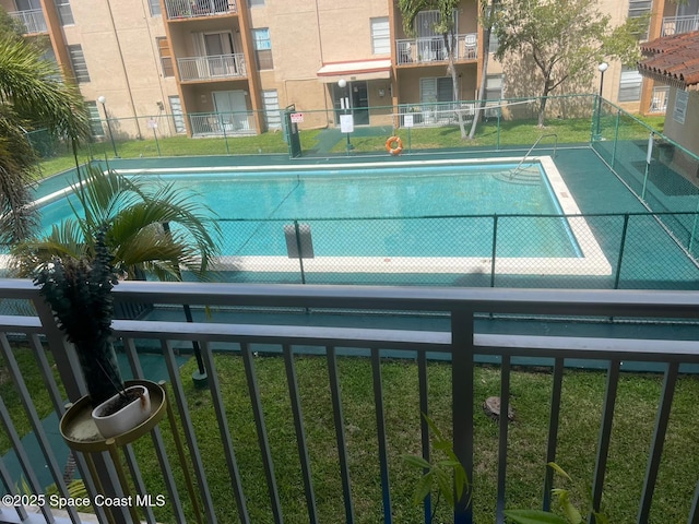 4841 NW 7th St Unit 203-4, Miami, FL 33126 - view of swimming pool with a yard and fence