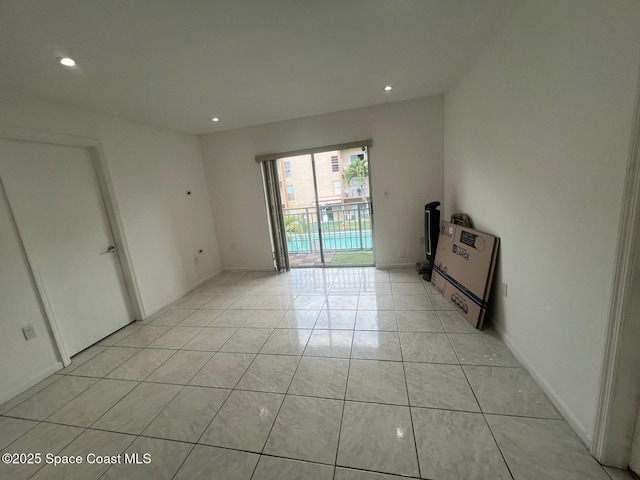 4841 NW 7th St Unit 203-4, Miami, FL 33126 - empty room with recessed lighting and light tile patterned flooring