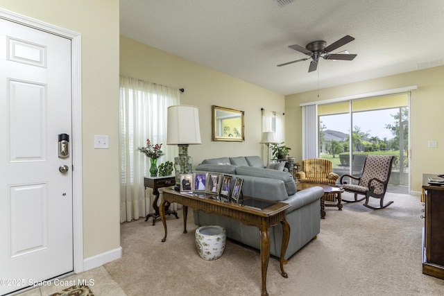 6008 Van Ness Dr, Melbourne, FL 32940 - living area featuring plenty of natural light, light carpet, and a ceiling fan