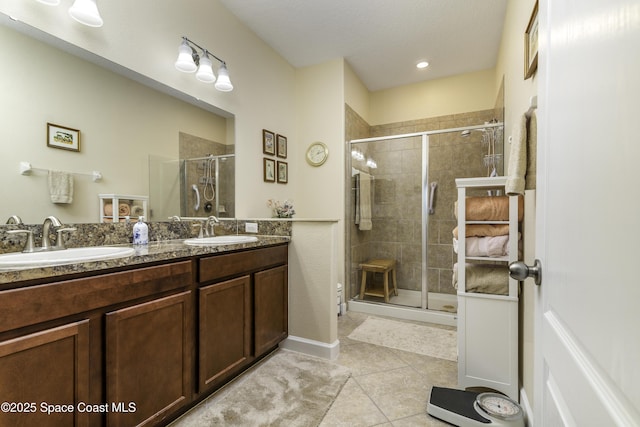 6008 Van Ness Dr, Melbourne, FL 32940 - full bath with double vanity, a shower stall, a sink, and tile patterned flooring