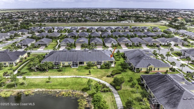 6008 Van Ness Dr, Melbourne, FL 32940 - drone / aerial view featuring a water view and a residential view