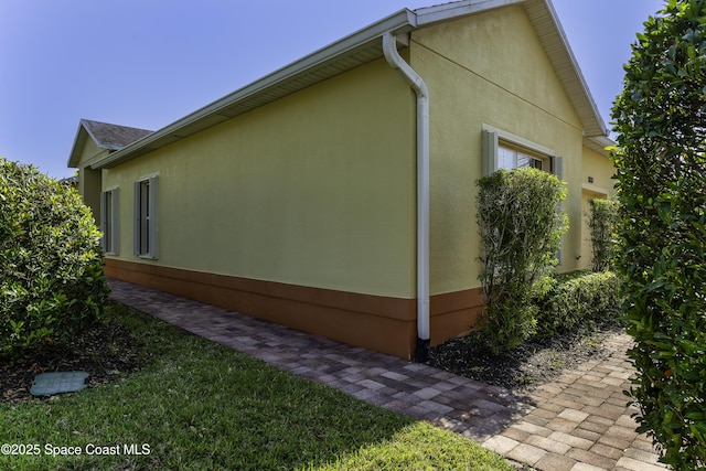 6008 Van Ness Dr, Melbourne, FL 32940 - view of side of property with stucco siding