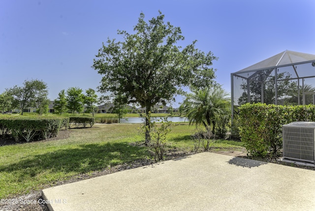 6008 Van Ness Dr, Melbourne, FL 32940 - view of patio / terrace featuring a water view, glass enclosure, and central air condition unit
