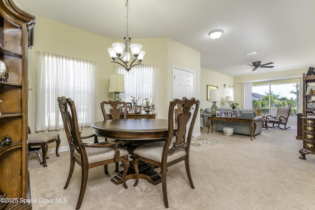 6008 Van Ness Dr, Melbourne, FL 32940 - dining area with baseboards, ceiling fan with notable chandelier, and light colored carpet