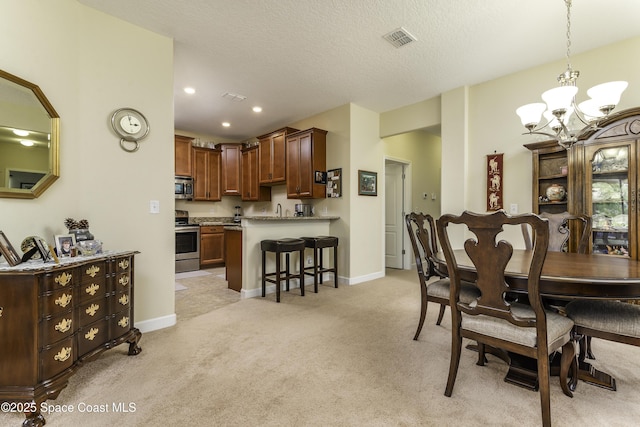 6008 Van Ness Dr, Melbourne, FL 32940 - dining space featuring baseboards, light carpet, a notable chandelier, and visible vents