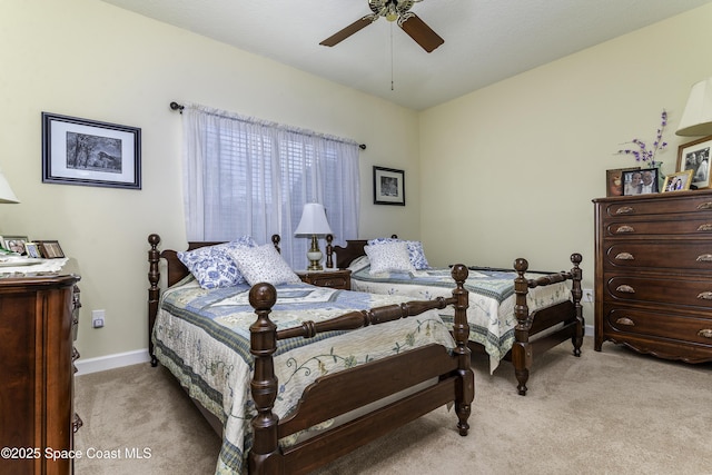 6008 Van Ness Dr, Melbourne, FL 32940 - bedroom featuring a ceiling fan, baseboards, and light colored carpet