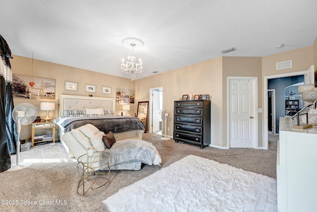 bedroom featuring baseboards, visible vents, an inviting chandelier, and carpet floors