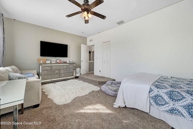 bedroom with visible vents, ceiling fan, and carpet