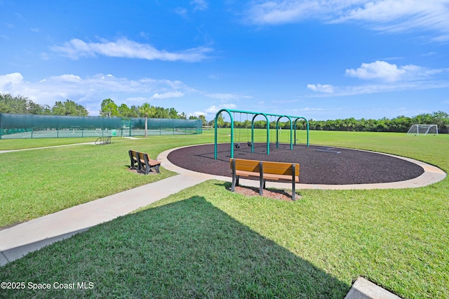 communal playground featuring a lawn