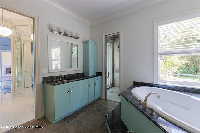 bathroom with crown molding, a garden tub, a shower stall, and vanity