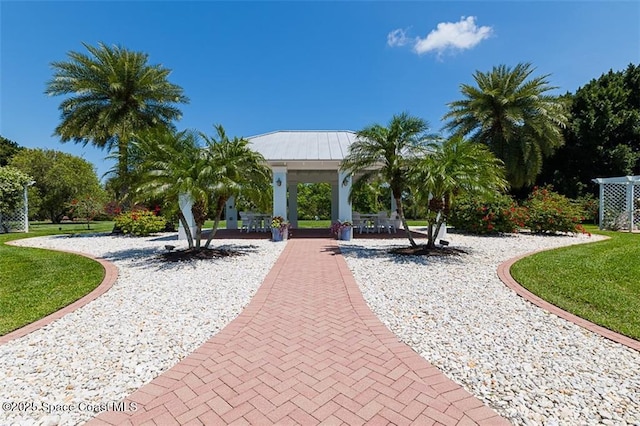 surrounding community featuring a gazebo and a lawn