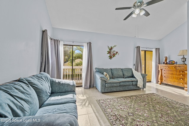 living room featuring ceiling fan, tile patterned flooring, and lofted ceiling