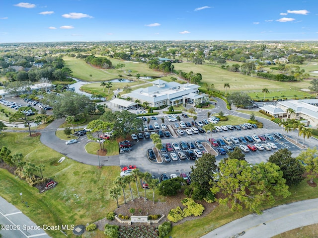 aerial view with a water view and golf course view
