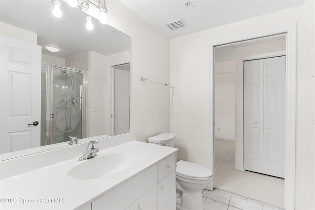 104 Riverside Dr Unit 402, Cocoa, FL 32922 - full bath with tile patterned flooring, vanity, toilet, visible vents, and a stall shower