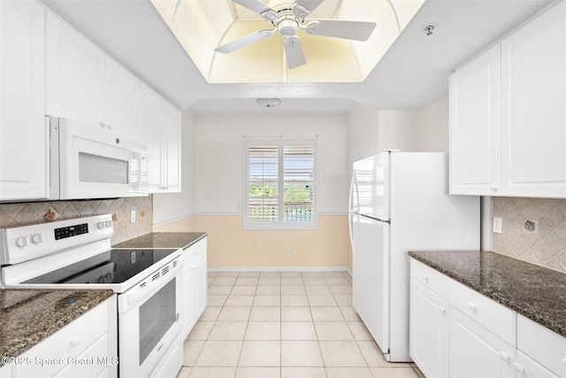 104 Riverside Dr Unit 402, Cocoa, FL 32922 - kitchen featuring white cabinets and white appliances