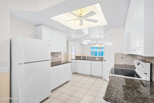 104 Riverside Dr Unit 402, Cocoa, FL 32922 - kitchen featuring light tile patterned flooring, white appliances, ceiling fan, white cabinetry, and tasteful backsplash