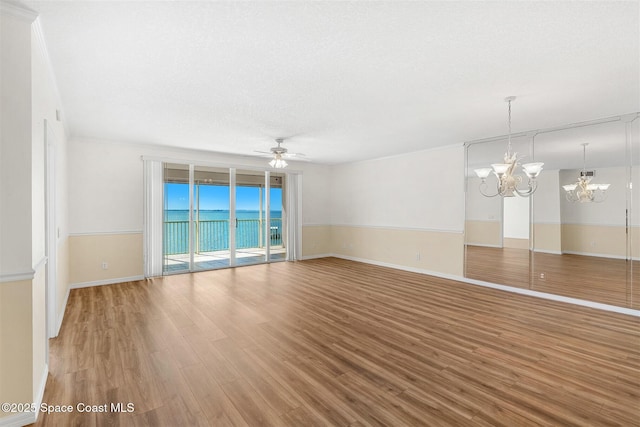 104 Riverside Dr Unit 402, Cocoa, FL 32922 - interior space with baseboards, ceiling fan with notable chandelier, and light wood finished floors