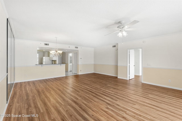 104 Riverside Dr Unit 402, Cocoa, FL 32922 - unfurnished living room with ceiling fan with notable chandelier, light wood-type flooring, and visible vents