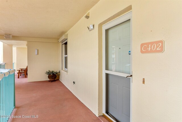 104 Riverside Dr Unit 402, Cocoa, FL 32922 - property entrance featuring stucco siding