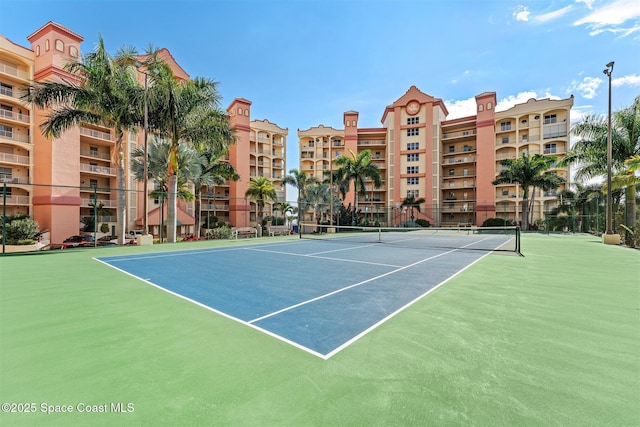 104 Riverside Dr Unit 402, Cocoa, FL 32922 - view of tennis court featuring fence and community basketball court