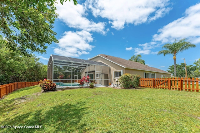 2100 Weatherly Ave, Melbourne, FL 32904 - back of house with a lawn, glass enclosure, a fenced in pool, a fenced backyard, and stucco siding
