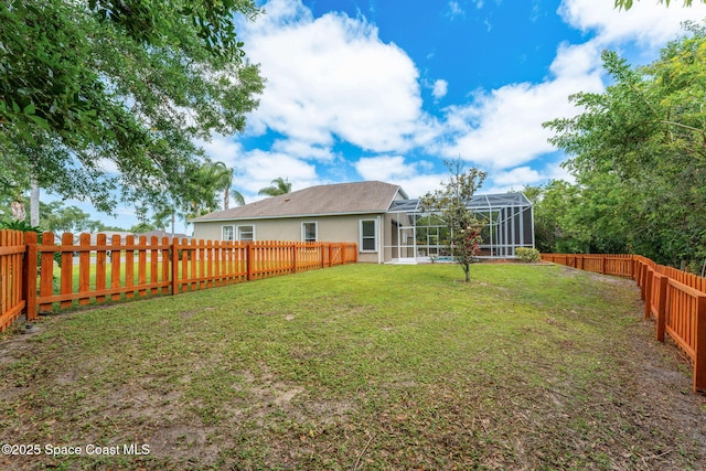 2100 Weatherly Ave, Melbourne, FL 32904 - view of yard featuring a fenced backyard and a lanai