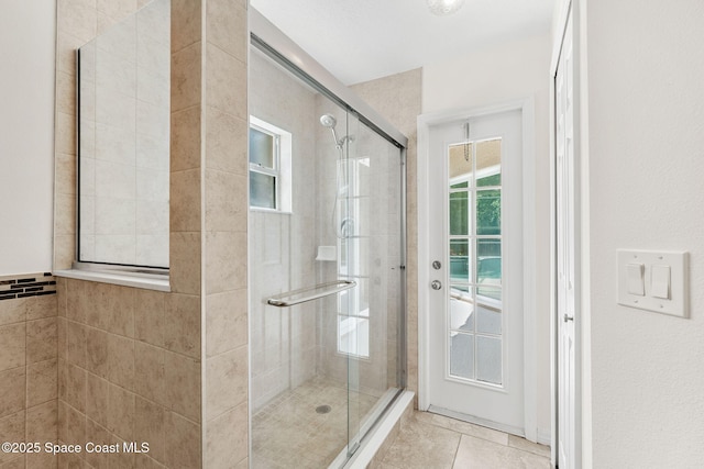 2100 Weatherly Ave, Melbourne, FL 32904 - full bathroom featuring tile patterned flooring and a shower stall
