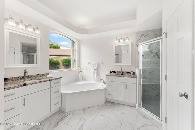 2100 Weatherly Ave, Melbourne, FL 32904 - bathroom featuring a garden tub, a shower stall, two vanities, a sink, and marble finish floor