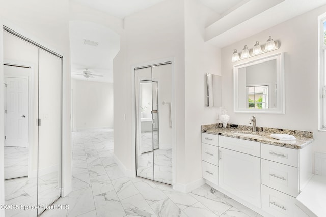 2100 Weatherly Ave, Melbourne, FL 32904 - bathroom featuring ceiling fan, visible vents, baseboards, vanity, and marble finish floor