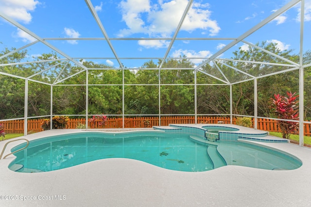 2100 Weatherly Ave, Melbourne, FL 32904 - view of swimming pool with a pool with connected hot tub, a lanai, a fenced backyard, and a patio area