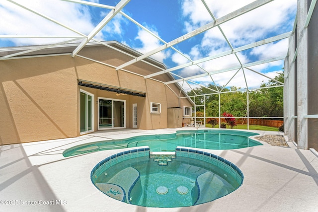 2100 Weatherly Ave, Melbourne, FL 32904 - view of pool featuring a patio, glass enclosure, and a pool with connected hot tub