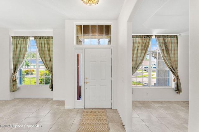 2100 Weatherly Ave, Melbourne, FL 32904 - tiled entrance foyer with baseboards and arched walkways