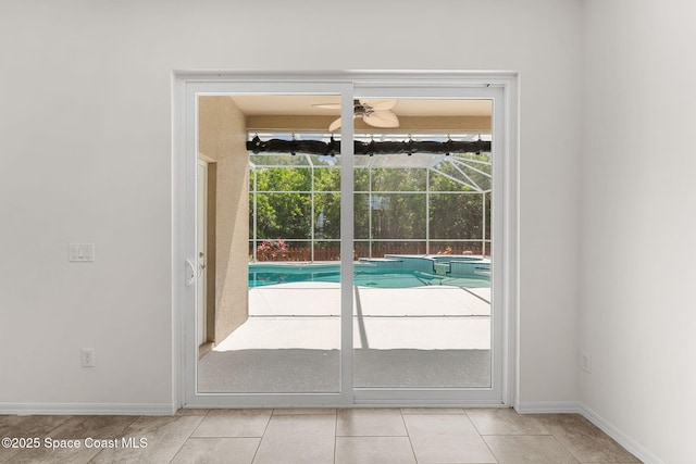 2100 Weatherly Ave, Melbourne, FL 32904 - entryway featuring a ceiling fan, baseboards, and light tile patterned floors