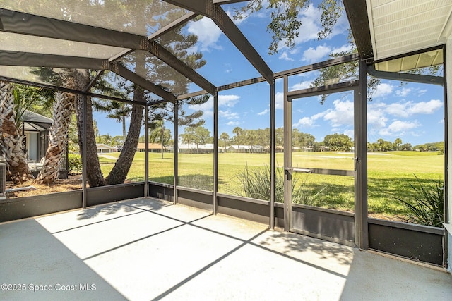 unfurnished sunroom featuring view of golf course