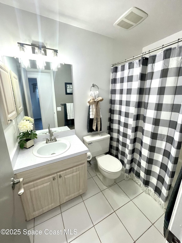 full bathroom featuring vanity, toilet, visible vents, tile patterned flooring, and a shower with shower curtain