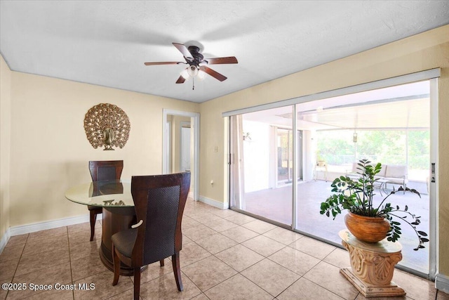15 Skyline Blvd, Merritt Island, FL 32953 - dining room featuring baseboards, ceiling fan, and light tile patterned floors