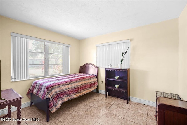 15 Skyline Blvd, Merritt Island, FL 32953 - bedroom with baseboards and light tile patterned floors