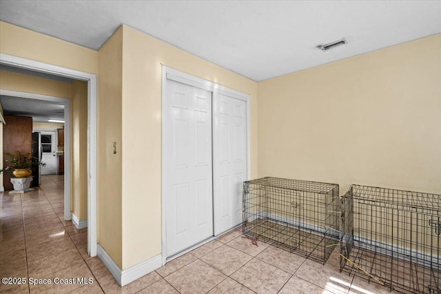 15 Skyline Blvd, Merritt Island, FL 32953 - bedroom featuring light tile patterned flooring, a closet, and baseboards