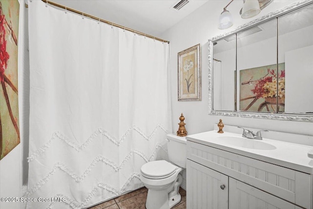 15 Skyline Blvd, Merritt Island, FL 32953 - bathroom with toilet, vanity, tile patterned flooring, and a shower with curtain