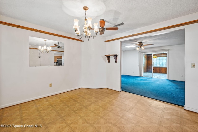 unfurnished room with baseboards, a textured ceiling, ceiling fan with notable chandelier, and visible vents