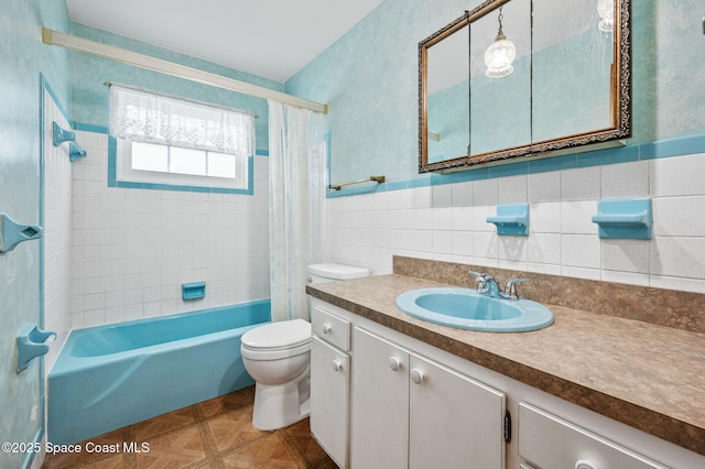 bathroom featuring toilet, tile walls, shower / bathtub combination with curtain, and vanity