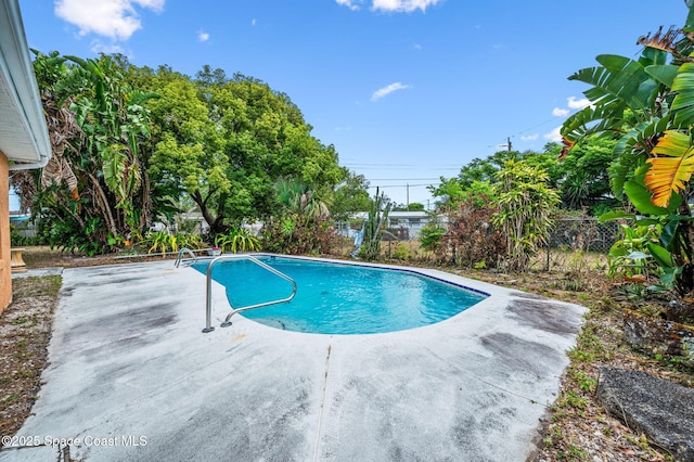 pool featuring a patio and a fenced backyard