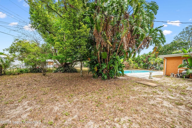 view of yard with a fenced in pool and a fenced backyard