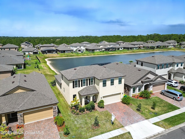birds eye view of property featuring a water view and a residential view