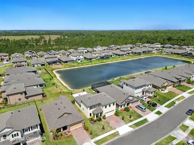 birds eye view of property featuring a water view and a residential view