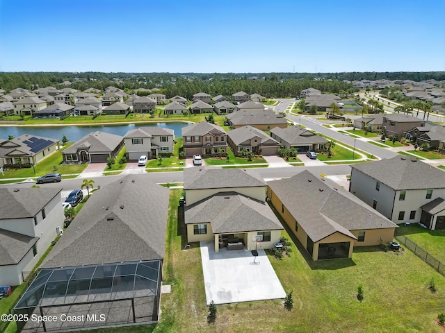 bird's eye view with a water view and a residential view