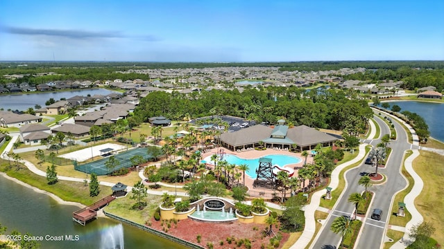 drone / aerial view featuring a water view and a residential view
