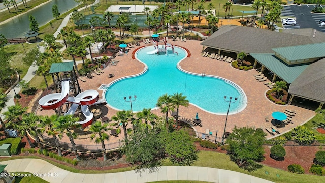 view of pool featuring a water view and a water slide